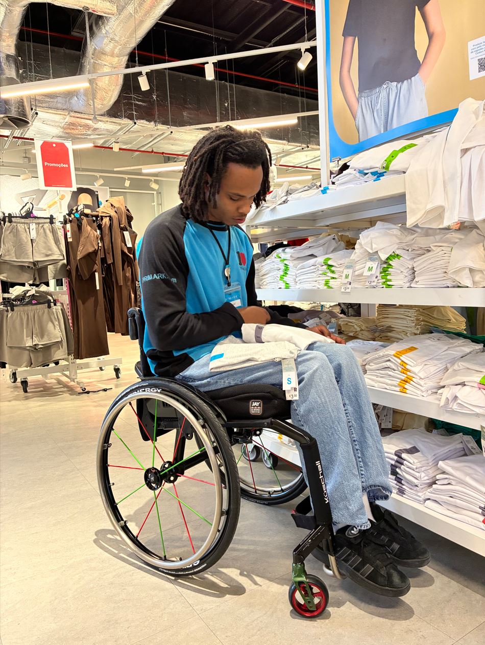 Male colleague in wheelchair working in a Primark store