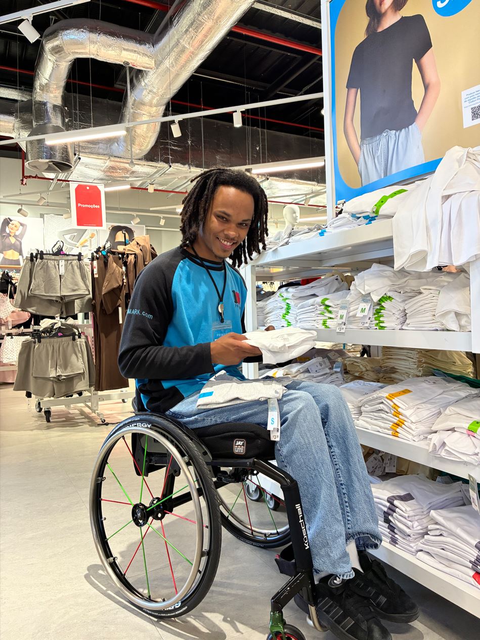 Male colleague in wheelchair working in a Primark store