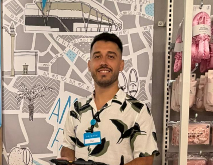 Colleague smiling at camera in store