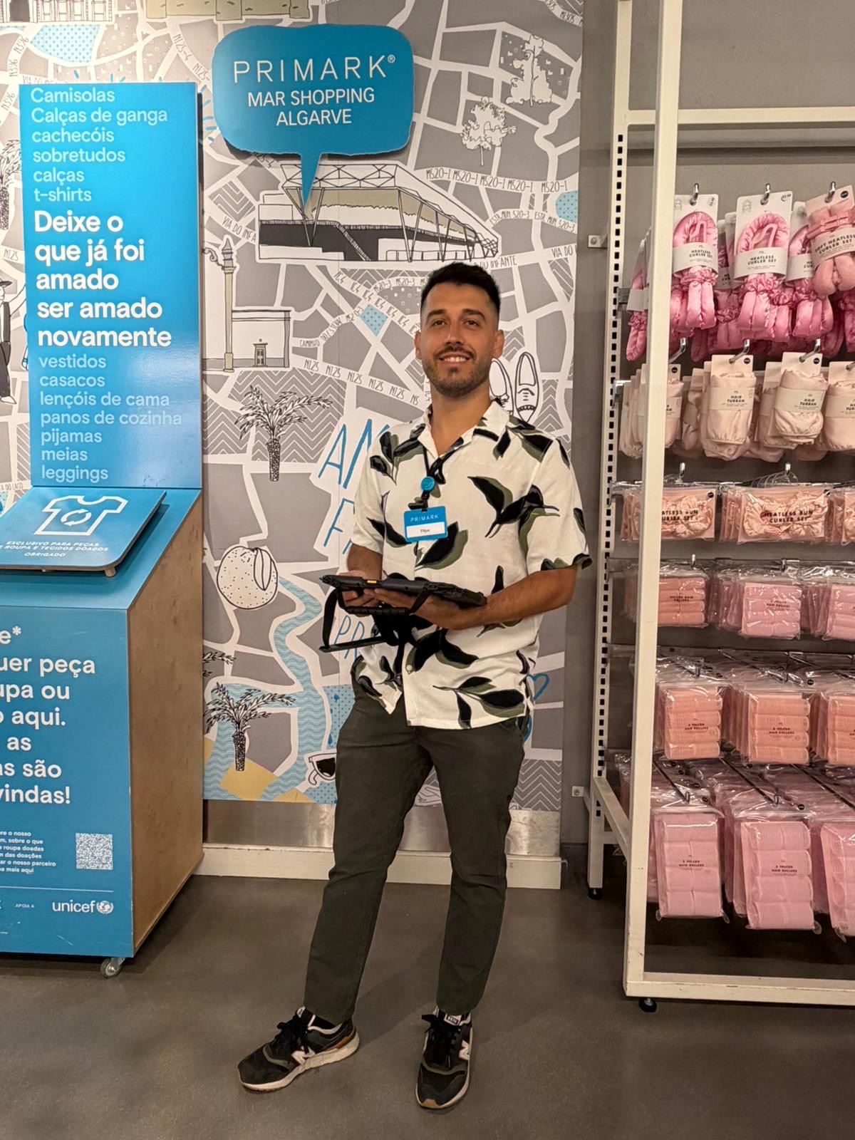 Colleague smiling at camera in store