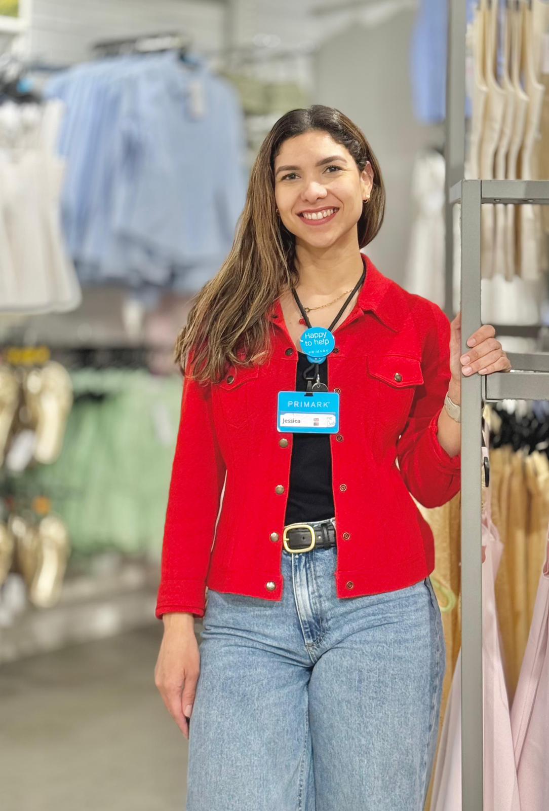 Colleague smiling in a Primark store