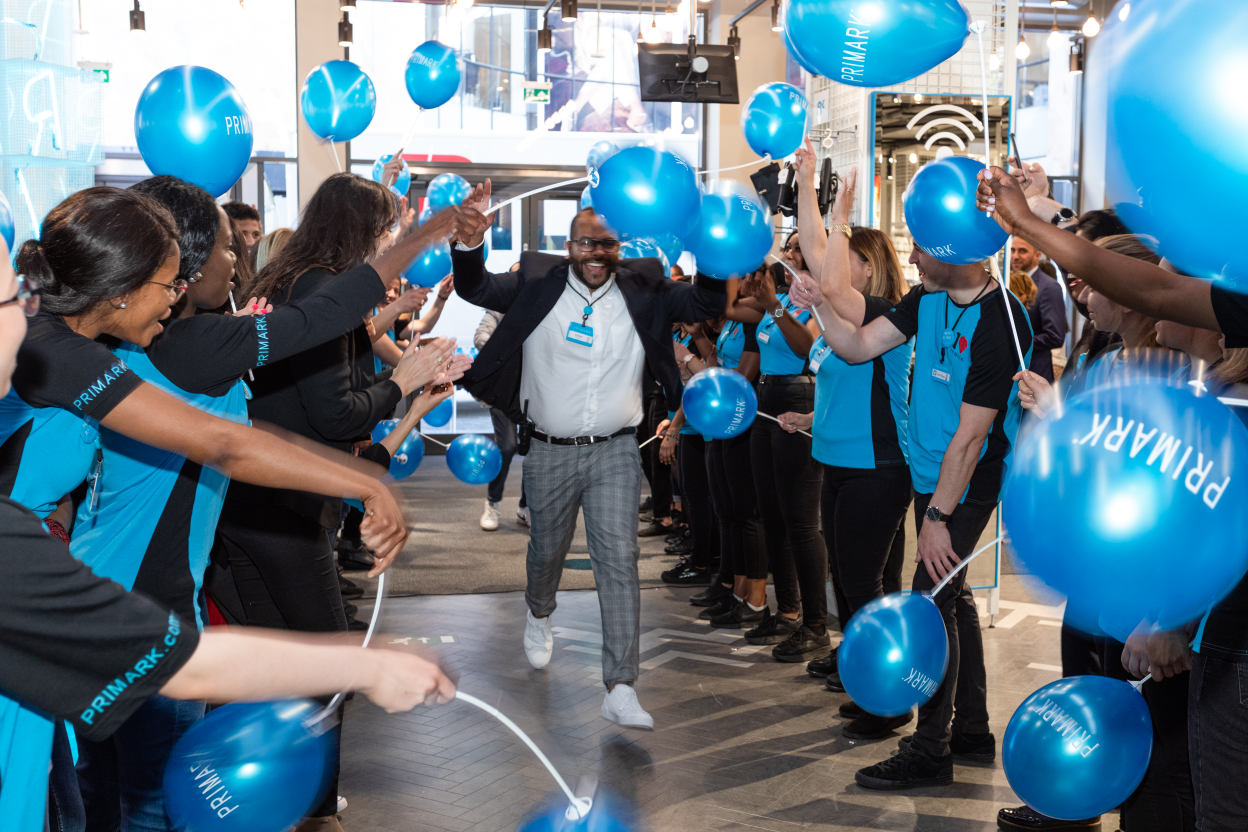 Colleague in a crowd at a new store opening celebration