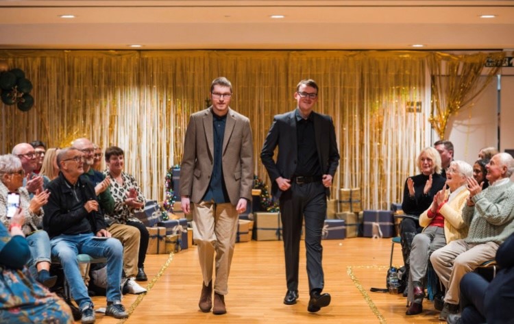 Colleagues walking in fashion show