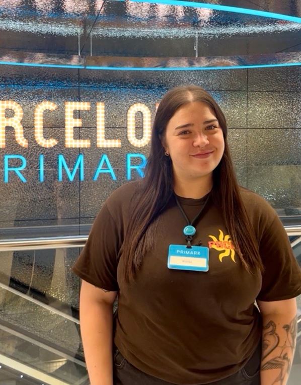 Female colleague smiling in a Primark store