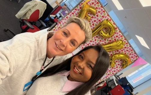 Colleagues smiling together in a selfie at a Primark office