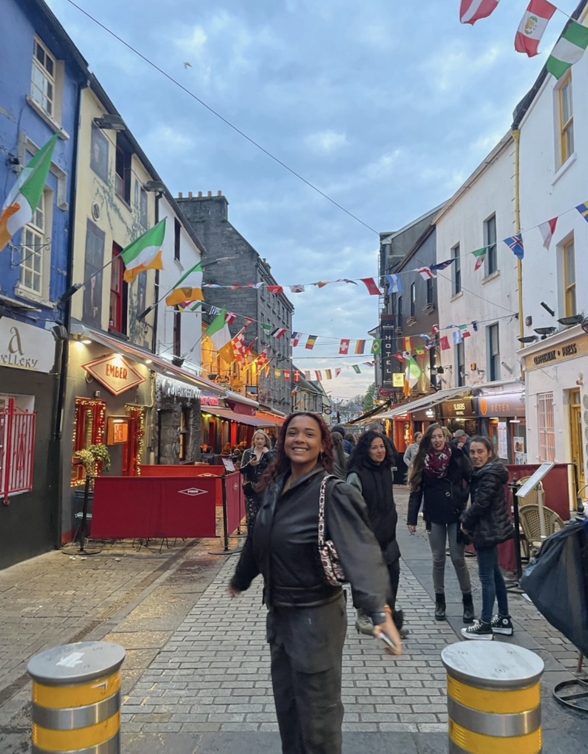 Female colleagues smiling in street in Ireland