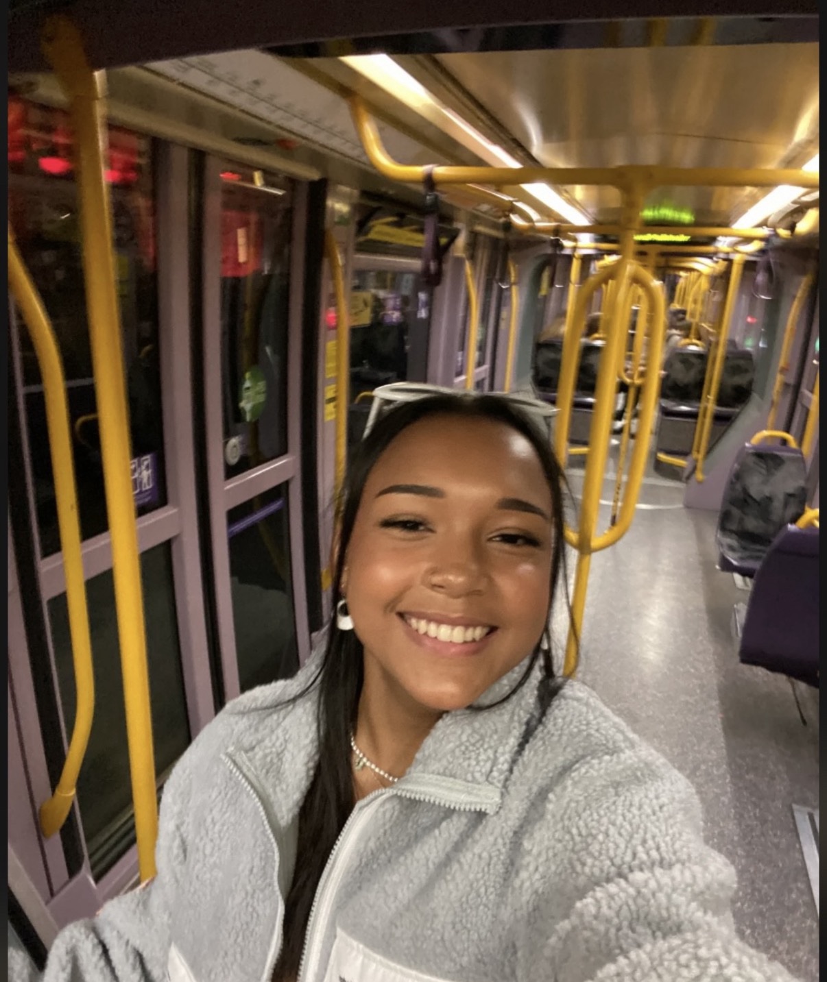 Female colleague smiling on LUAS (tram) in Dublin