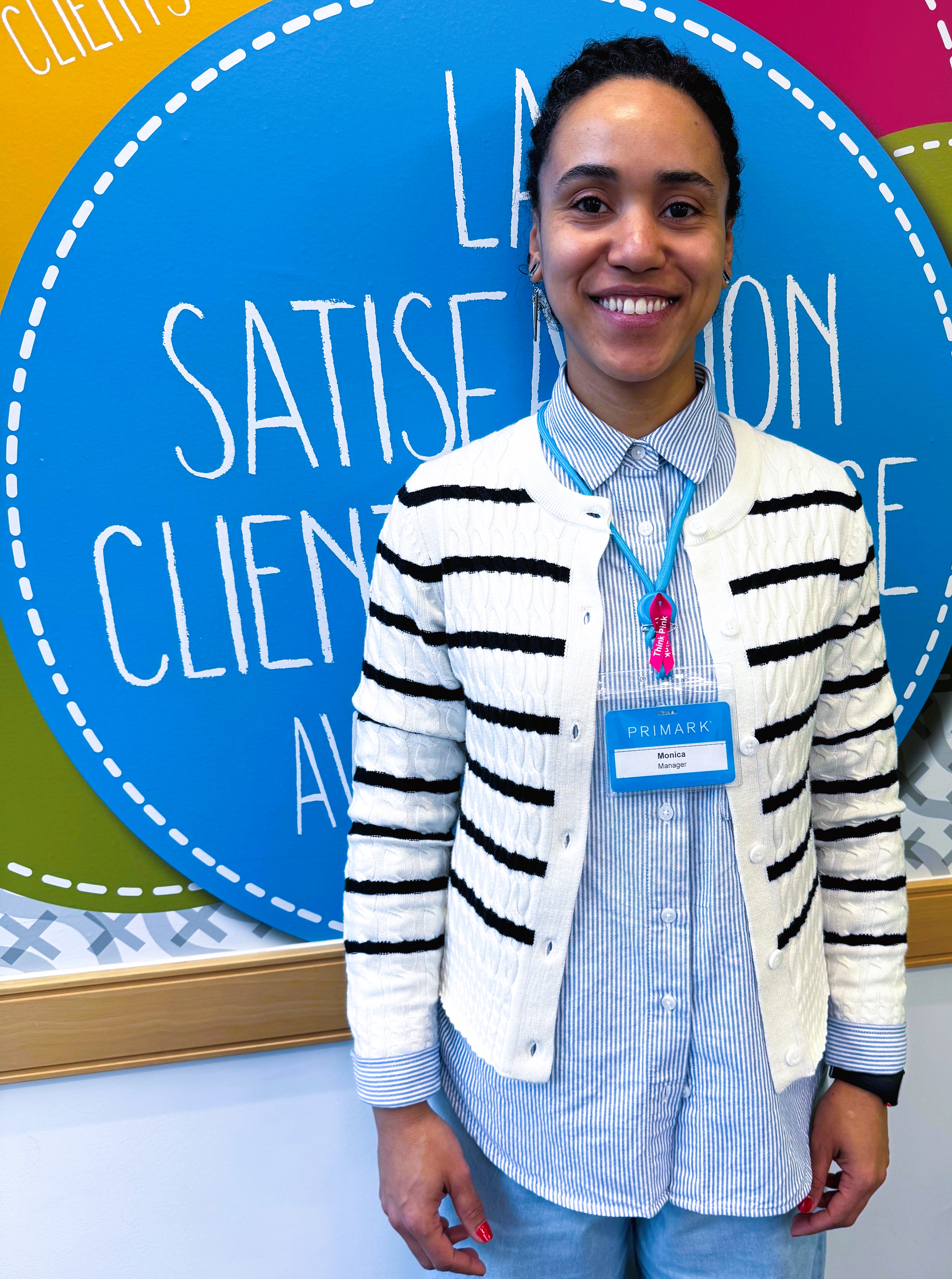 Colleague smiling in store