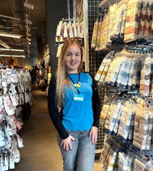 Colleague smiling in store