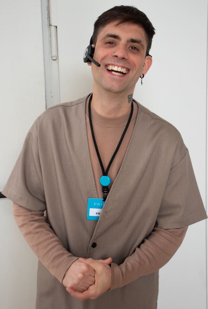 Male colleague smiling with hands together