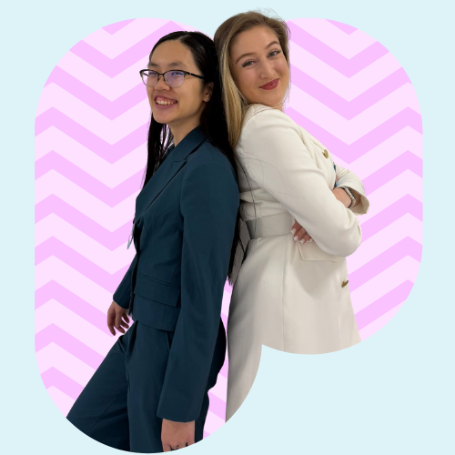 Colleagues standing back to back smiling