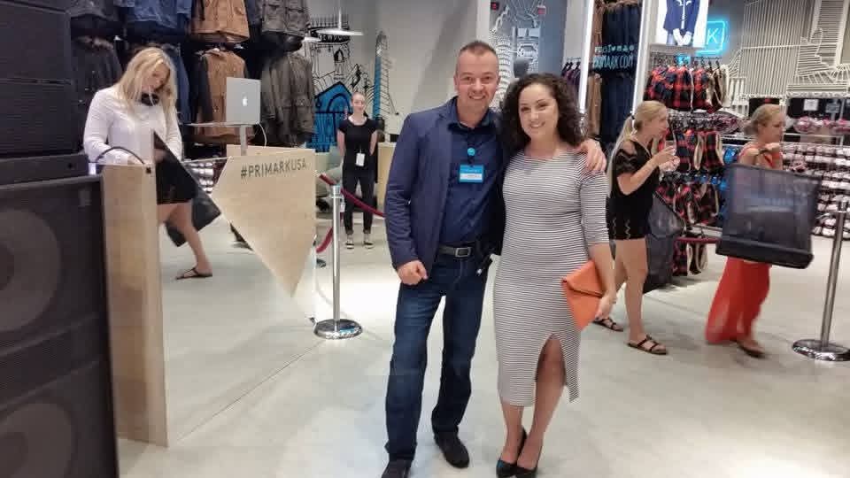 Colleagues smiling together at event