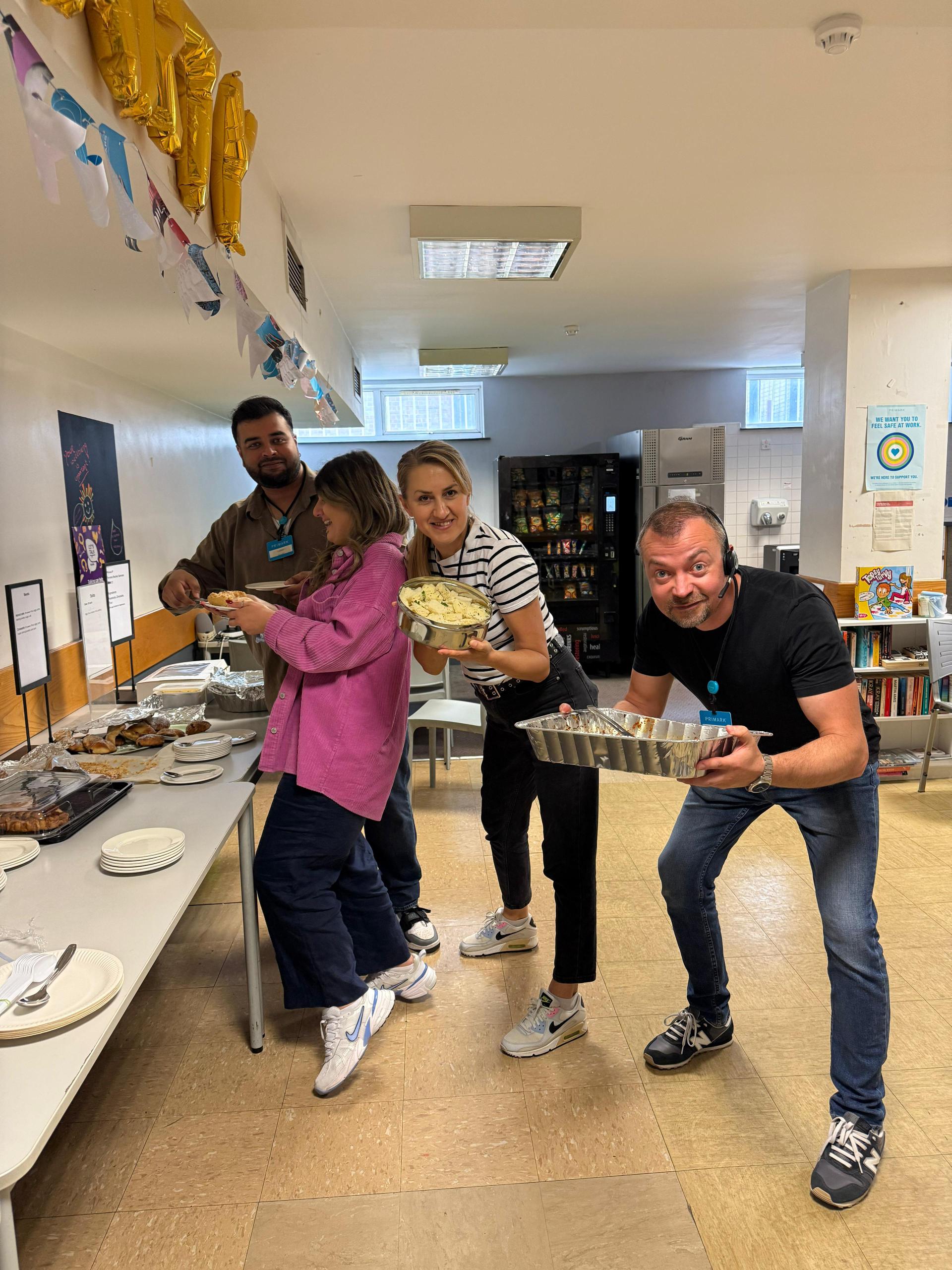 Colleagues setting up celebration in back of house