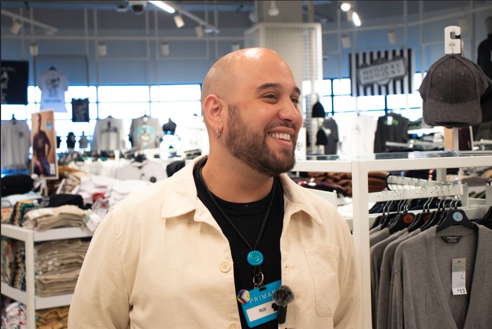 Male colleague smiling in a Primark store