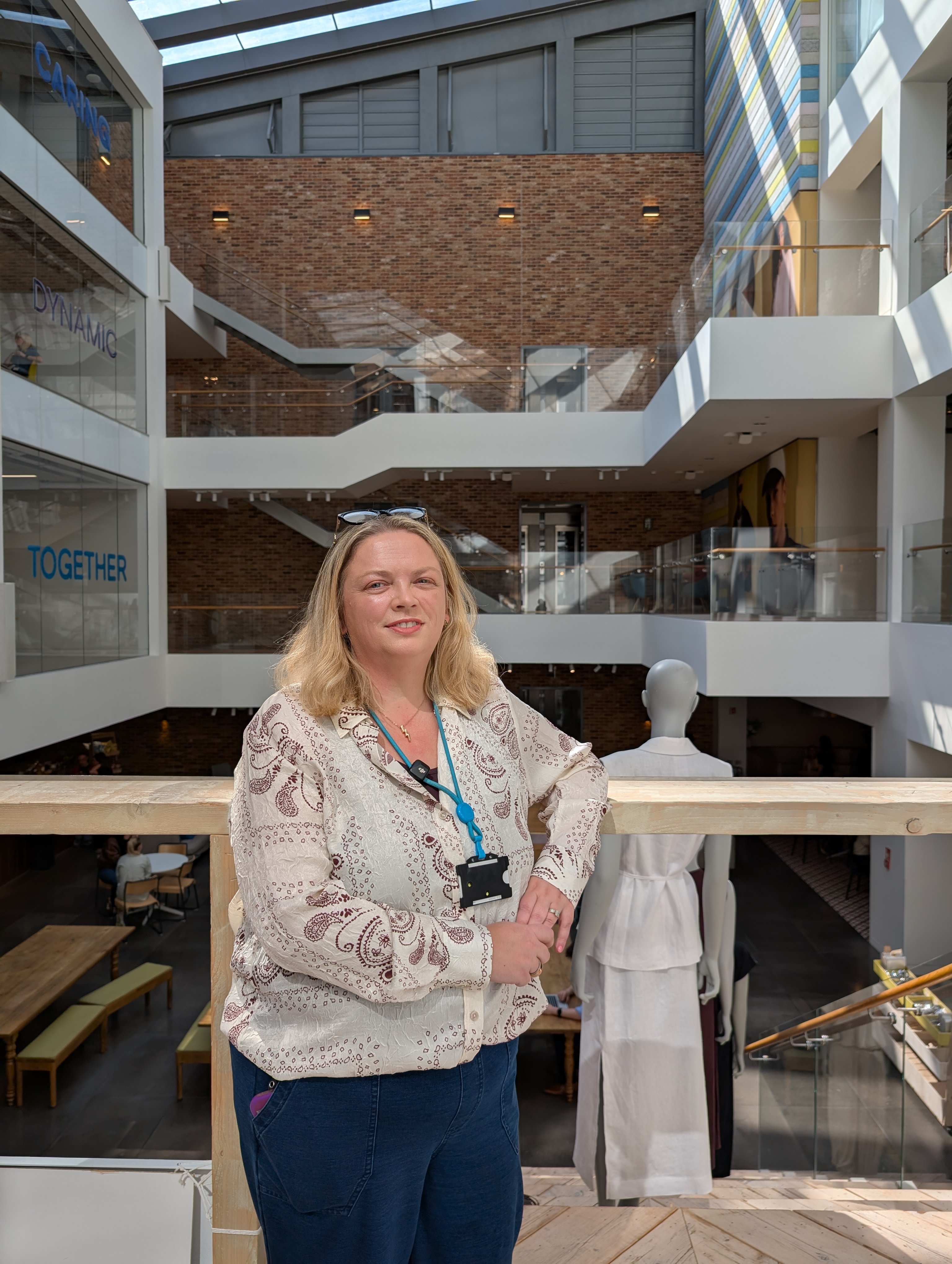 Female colleague standing and smiling in Primark Dublin Head Office