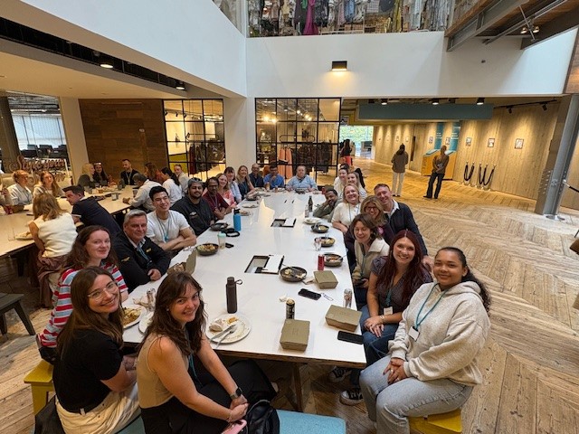 Group of colleagues sitting together eating lunch in Primark Dublin Head Office