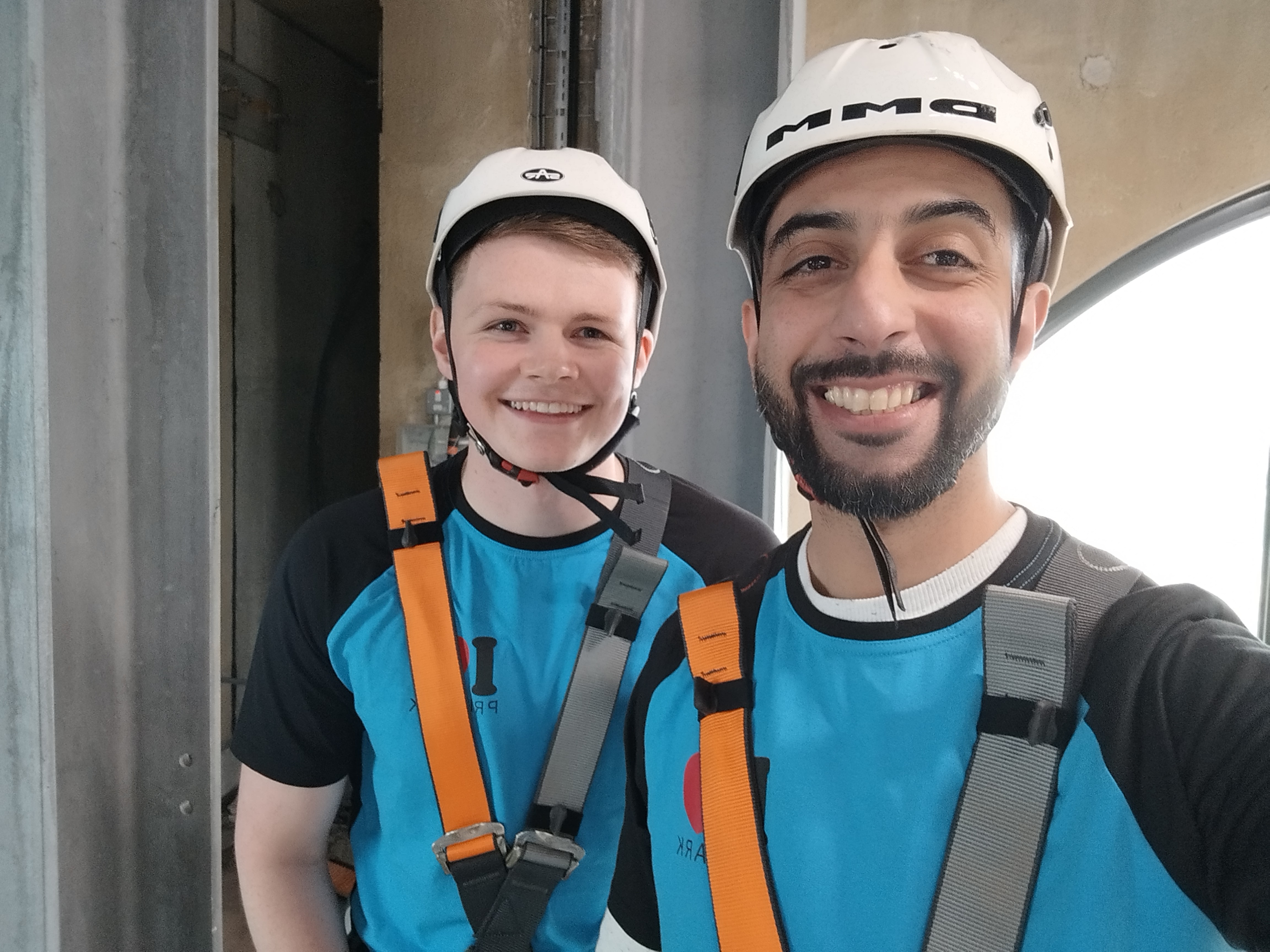 Two male colleagues smiling together