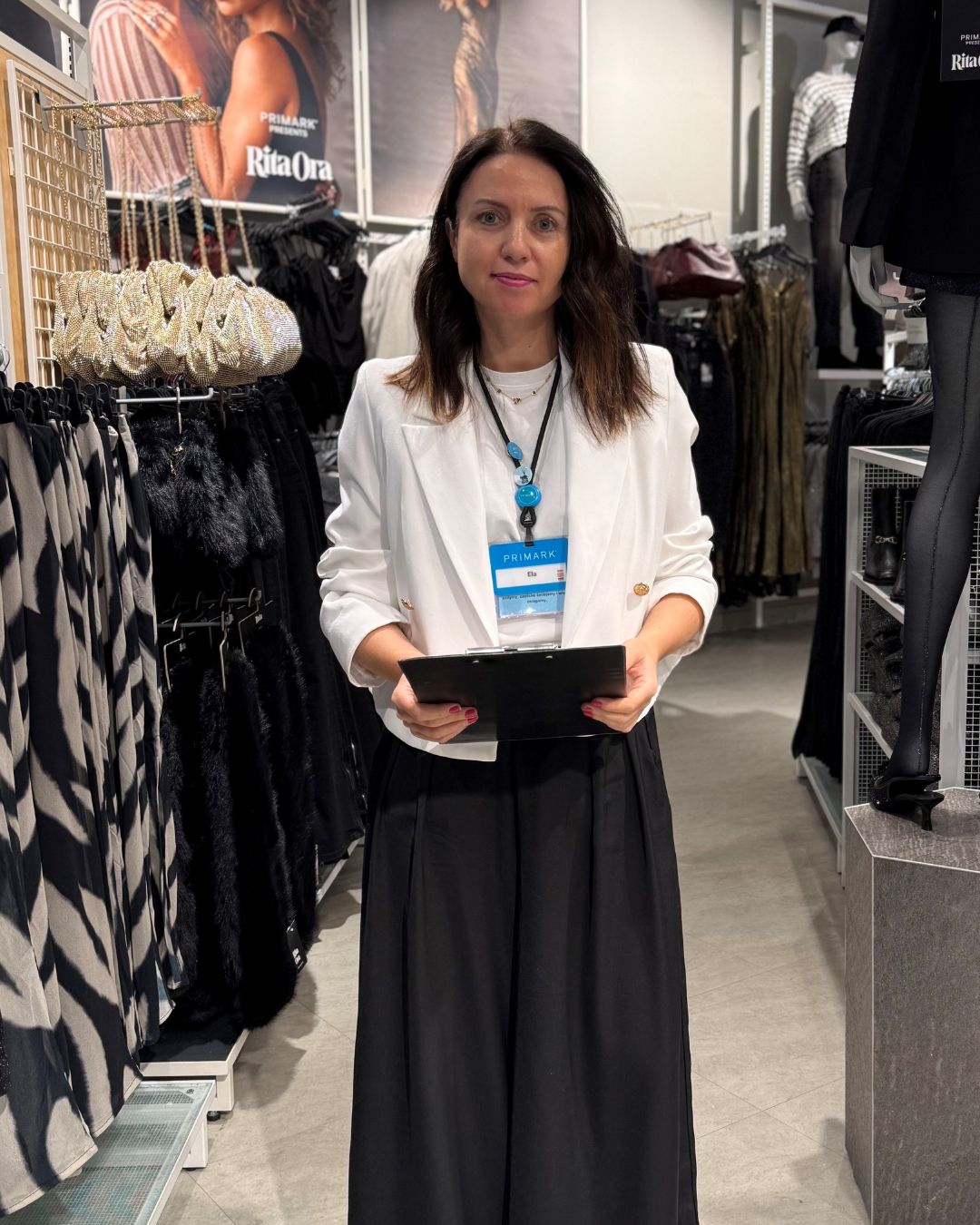 Colleague smiling in store