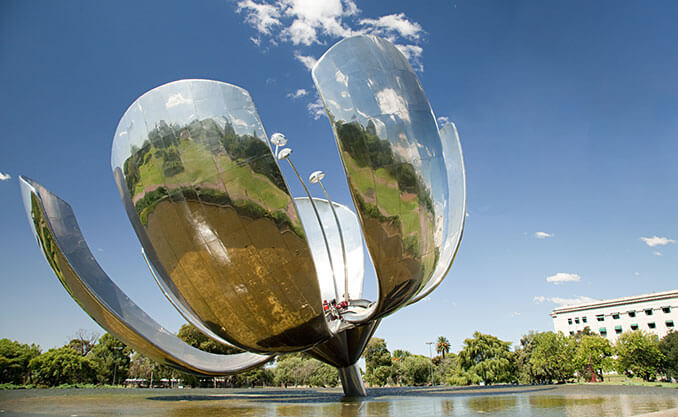 big metal flower looking object in water