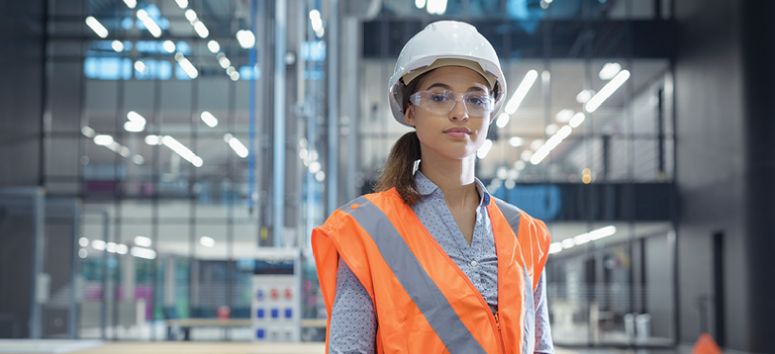 A young woman wearing safety gear.