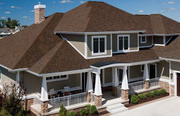 Brownwood Duration shingles on a beige Craftsman-style home