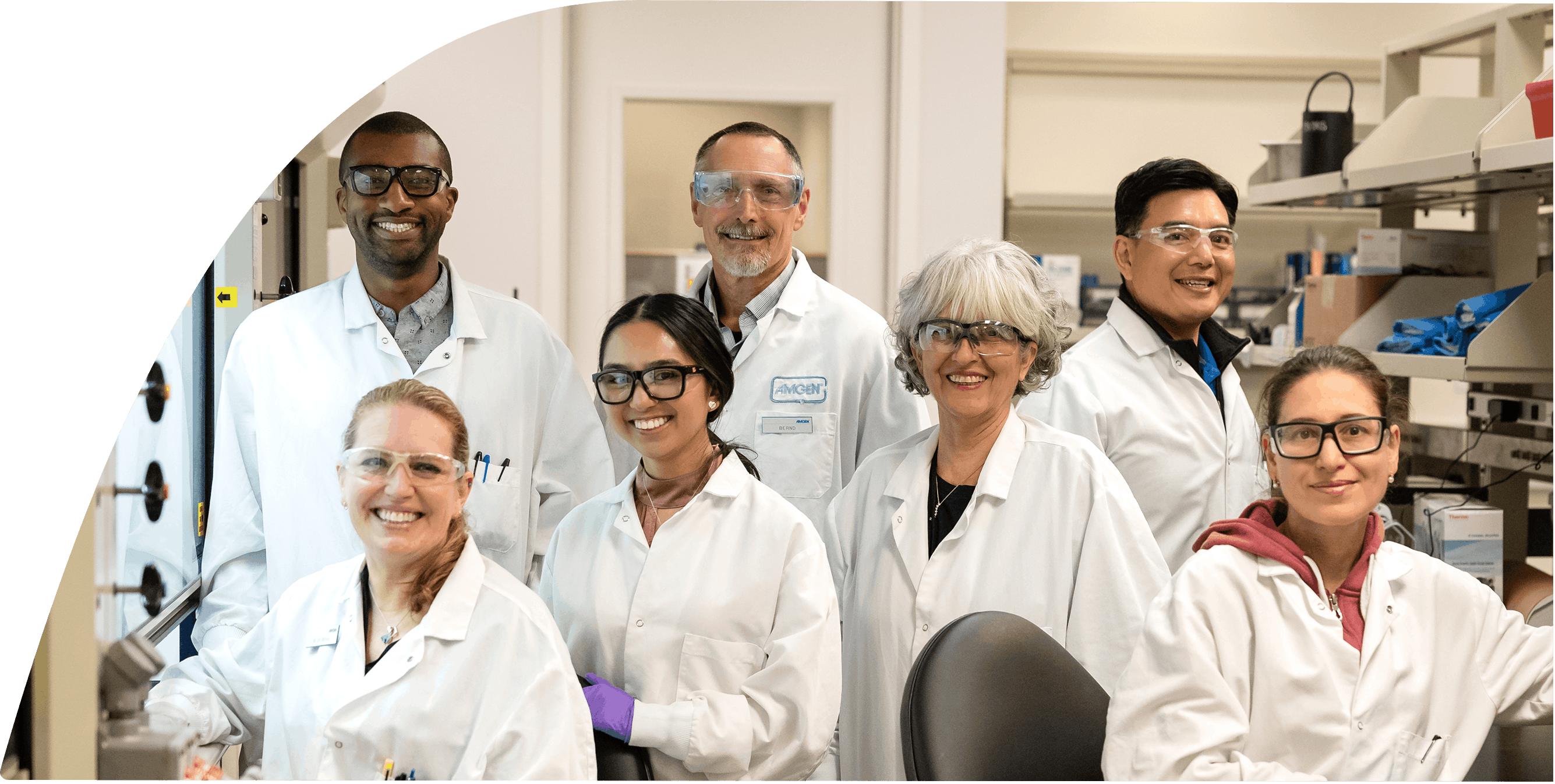 Two lab technicians smiling