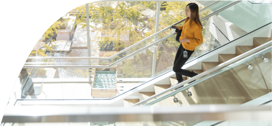 A woman going down stairs