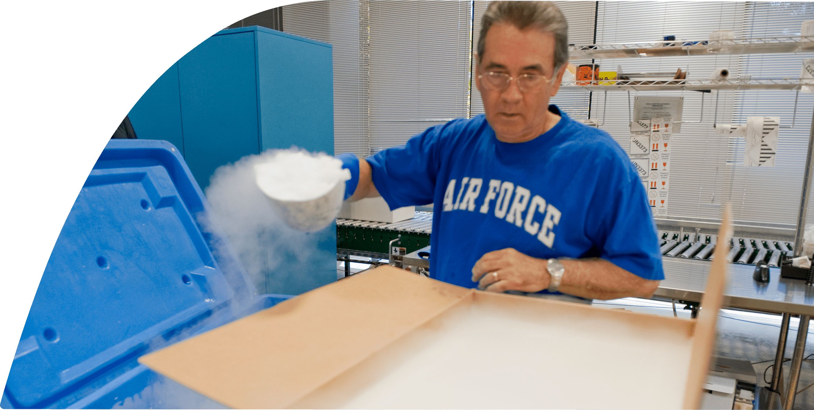 A man wearing an Air Force t-shirt is working