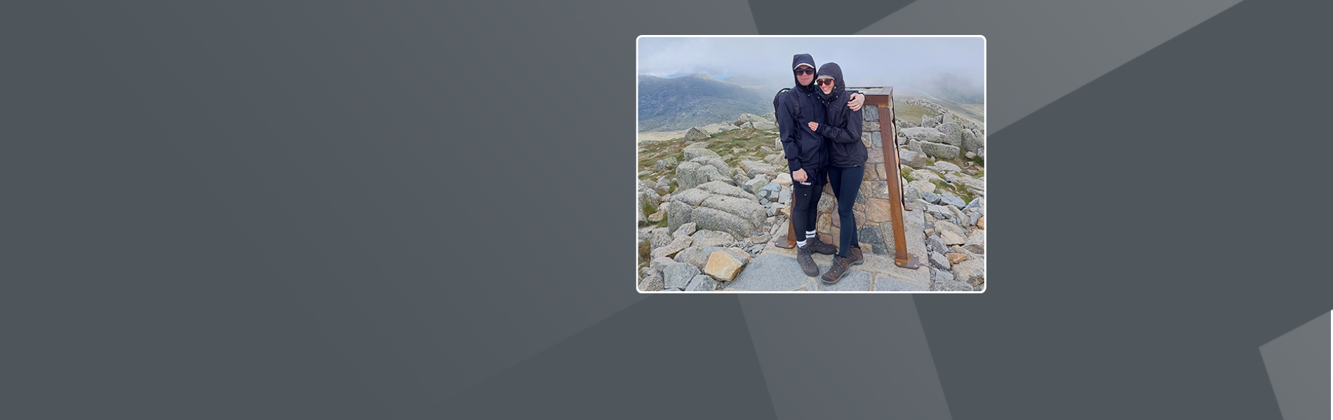 Adrian, an Australian Site Care Partner with his partner at a mountain top.