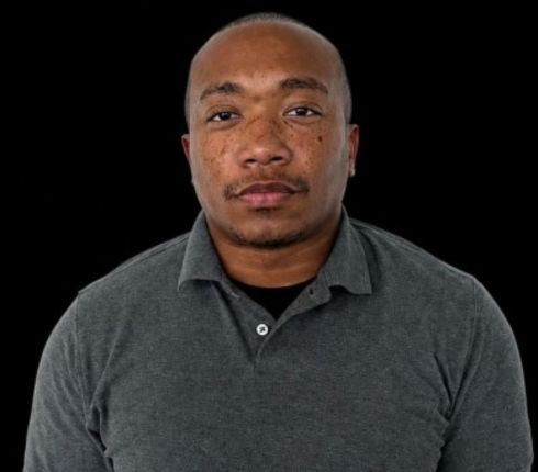 Matthew Moman, wearing a dark grey polo