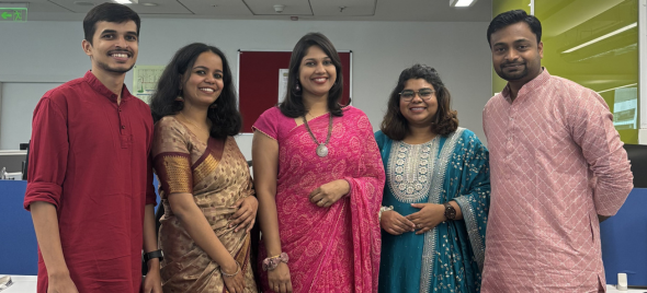 Mayurchandra with several colleagues in traditional Indian clothes at an office event.