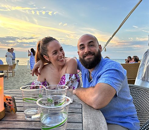 Steve, Director, IT Enterprise Infrastructure & Architecture at Parexel, with his partner at a beach dinner