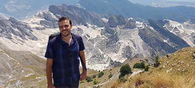 Yuri, brown haired male, standing on-top of a mountain
