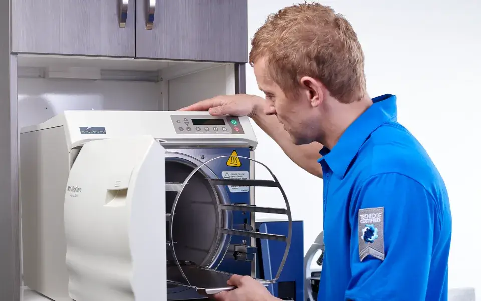 employee working on with a machine in a lab