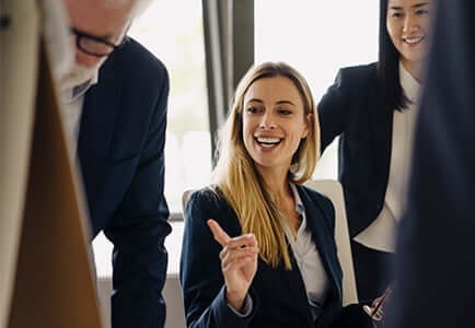 female employee smiling during a meeting