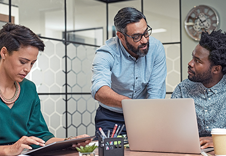 Three people working